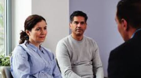 Photo of a couple talking to a doctor