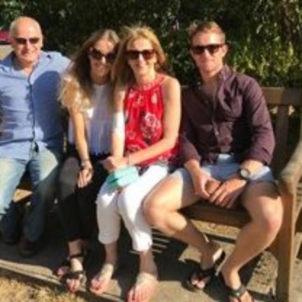 Kate, her husband, her daughter and son, sat on a park bench