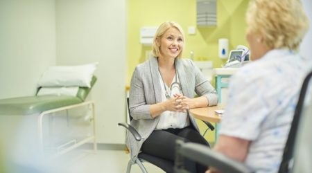 Female GP listening to patient