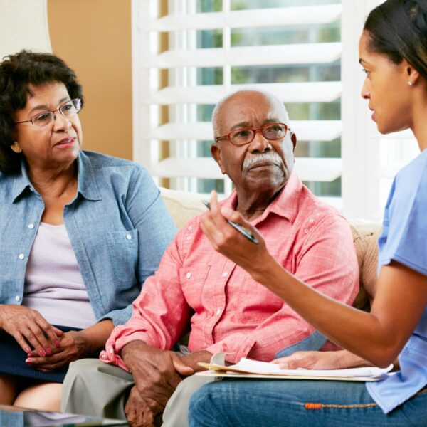 A nurse talking to couple