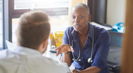 Doctor talking to male patient