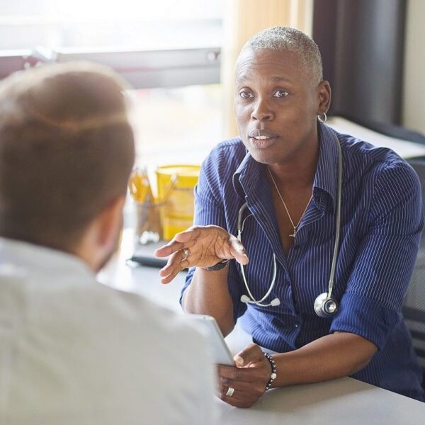 Doctor talking to male patient