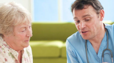 Woman speaking to a doctor at her medical appointment