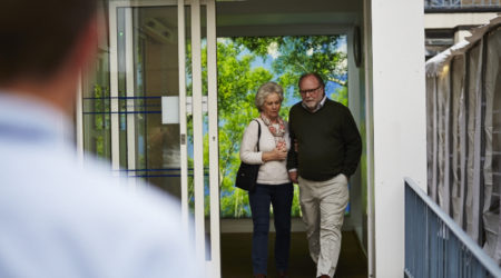 An older couple leaving the hospital