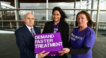 Supporters and staff from Pancreatic Cancer UK handing a petition into the Welsh Assembly