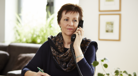 Lady on the telephone making notes