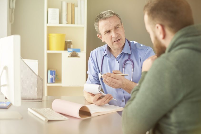 Doctor and patient having a discussion in the doctor's surgery