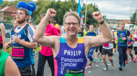 PCUK runner Philip celebrates during the Cardiff Half Marathon