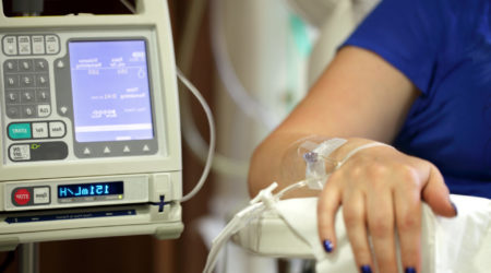A machine delivering chemotherapy through an intravenous drip.