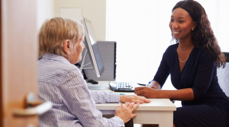 A woman has an appointment with her doctor in a GP office