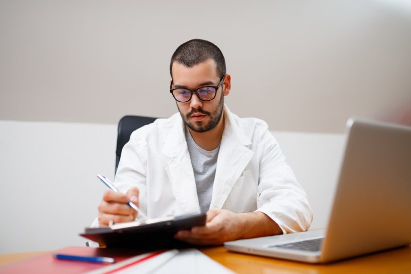 Scientist checking paperwork