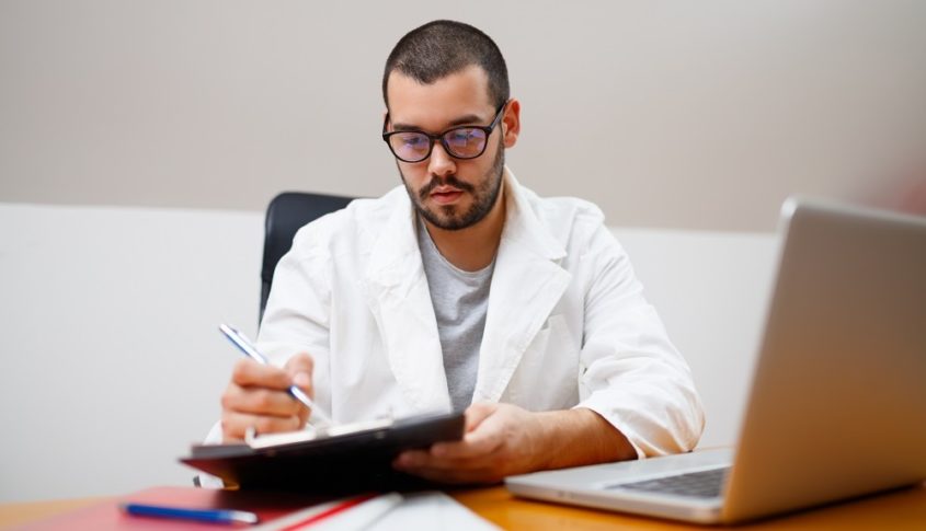 Scientist checking paperwork