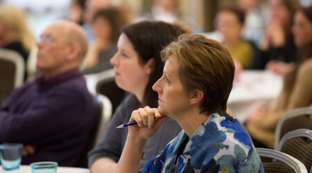 Lady on a table with listening to a talk