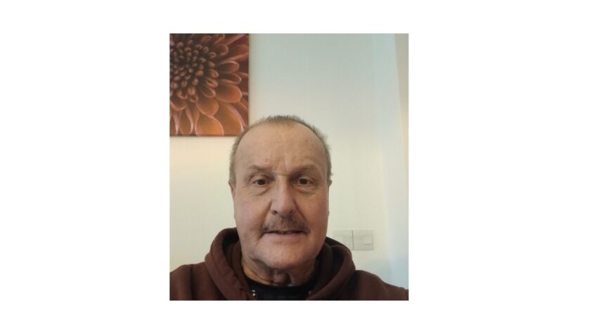 Older man looking to camera