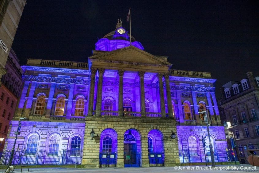 Liverpool Town Hall lit up purple