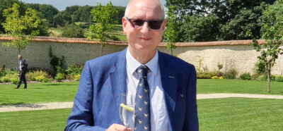 Charles Czaijkowski wearing a suit and smiling