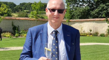 Charles Czaijkowski wearing a suit and smiling