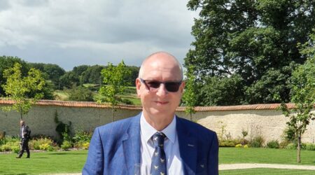 Charles Czaijkowski wearing a suit and smiling