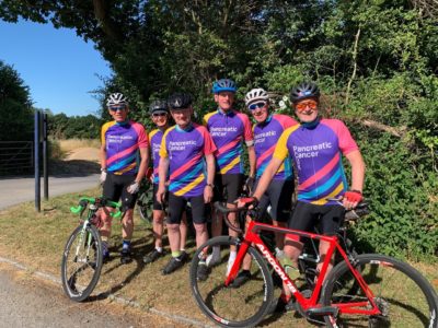 A team photo of the Friday Boys cycling group wearing their PCUK cycling jerseys