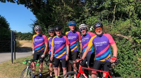 A team photo of the Friday Boys cycling group wearing their PCUK cycling jerseys