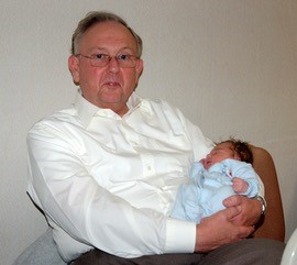 A man holding a small child - clive - real life stories PCUK
