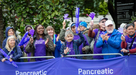 Pancreatic cancer uk volunteers and supporters cheering on the marathon runners