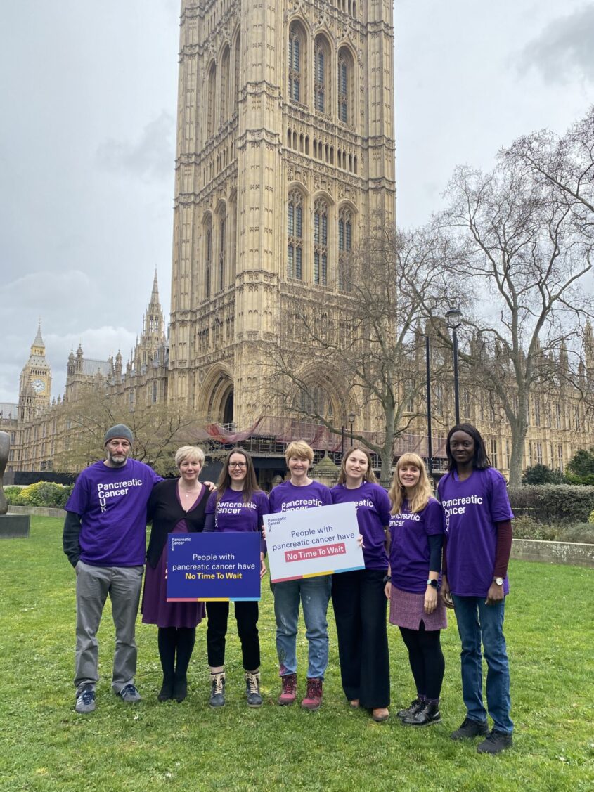 Pancreatic Cancer UK campaigners on College Green with the Houses of Parliament in the background