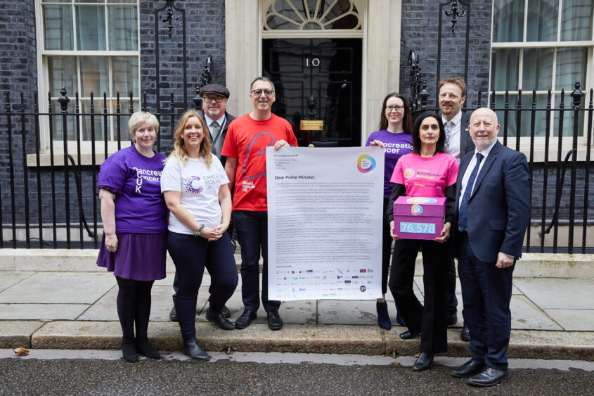 Members of the One Cancer Voice coalition including Pancreatic Cancer UK handing in the petition at No 10 Downing Street