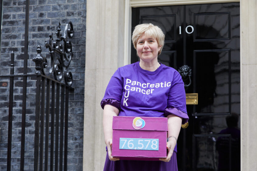 Rebecca Buggs, who was diagnosed with pancreatic cancer, handing in the One Cancer Voice petition at No 10 Downing Street