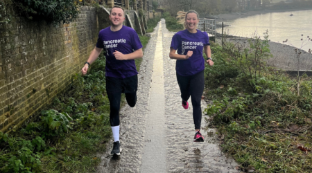 Two runners wearing PCUK tops