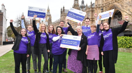 Our volunteers and staff celebrate outside the Houses of Parliament after our Don't Write Me Off event