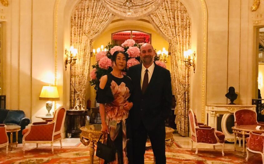 Man and woman in smart dress in fancy hotel lobby