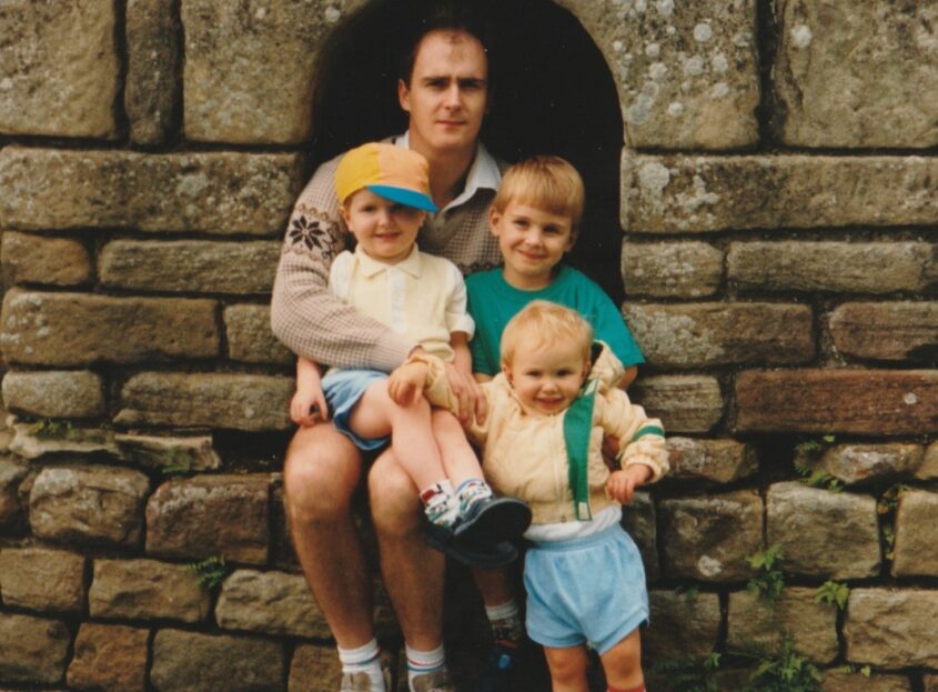 Lewis with his brothers and dad