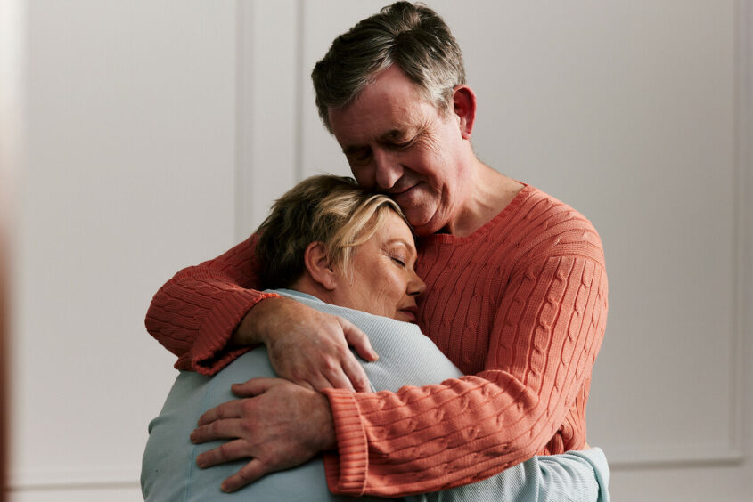 Two people embracing each other