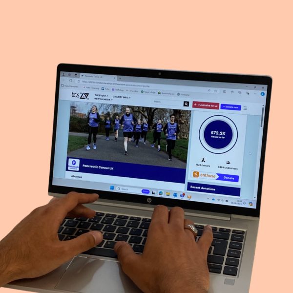 A laptop open on a Pancreatic Cancer UK fundraising page