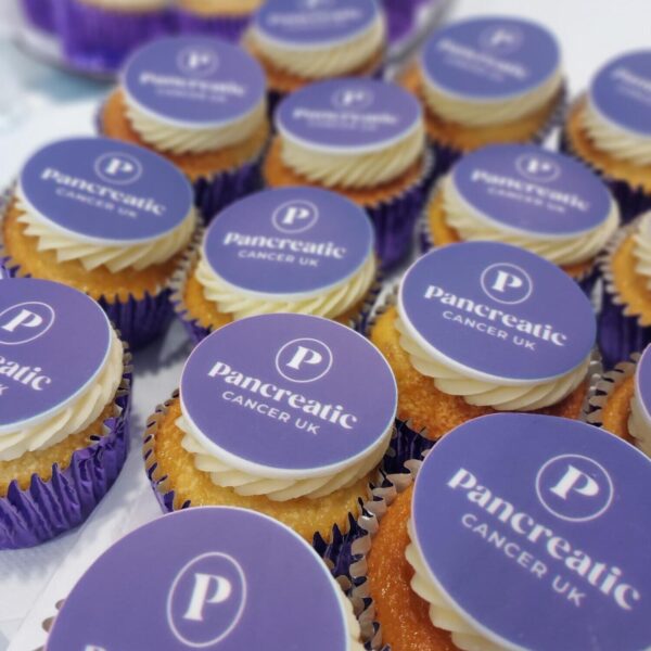 Cupcakes with Pancreatic Cancer UK logo branded on top of the icing