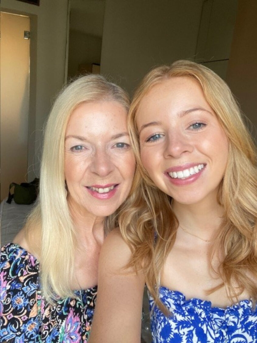 Woman and daughter headshot smiling to camera