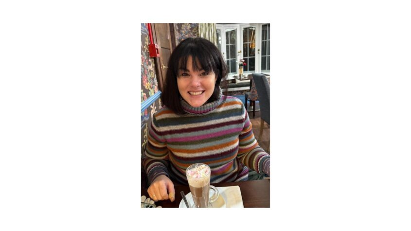 Emma having a hot chocolate in a cafe