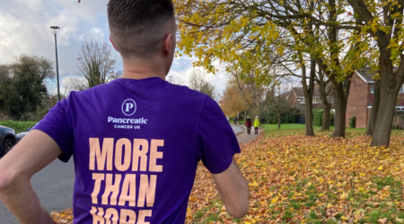 Man running in purple t shirt