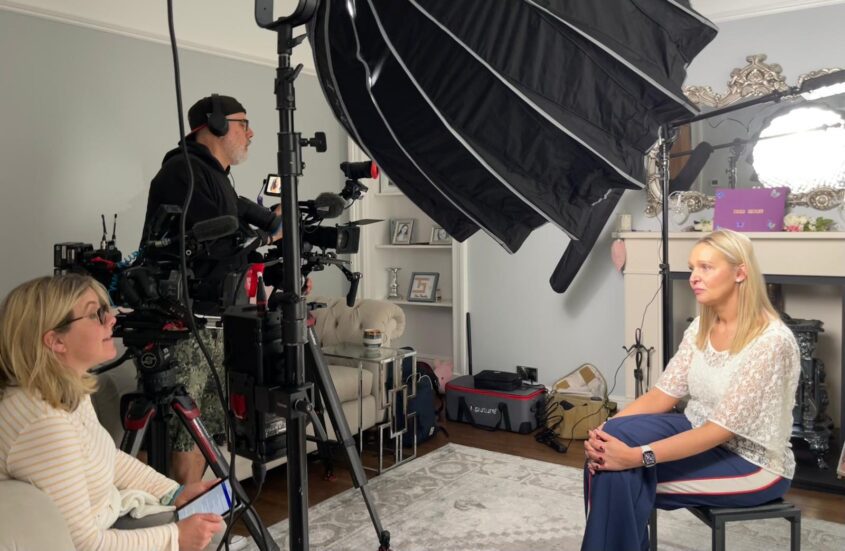 Jo Curtis being filmed by the BBC in her living room