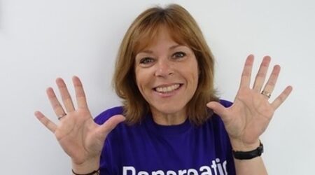 Image of Annie looking at the camera, wearing a Pancreatic Cancer t-shirt