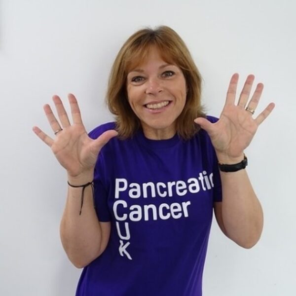 Image of Annie looking at the camera, wearing a Pancreatic Cancer t-shirt