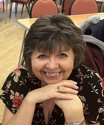 Image of volunteer Gail smiling at the camera