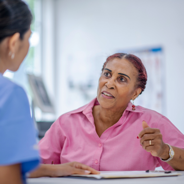 Someone at a medical appointment talking to a doctor