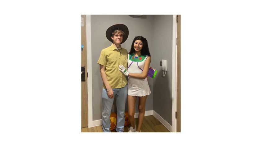 Young man and woman dressed as Buzz Lightyear and Woody from Toy Story