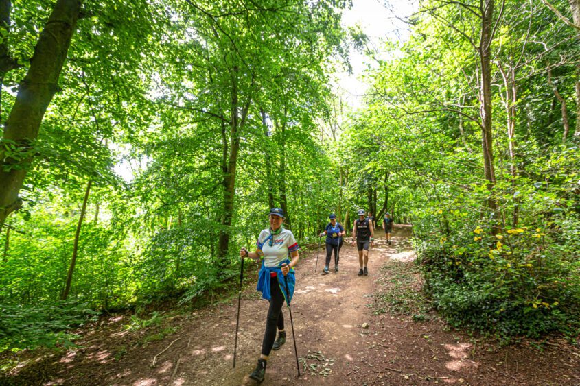 Supporters walking through Yorkshires woodland.