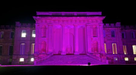 a landmark lit up purple for Pancreatic Cancer Awareness Month