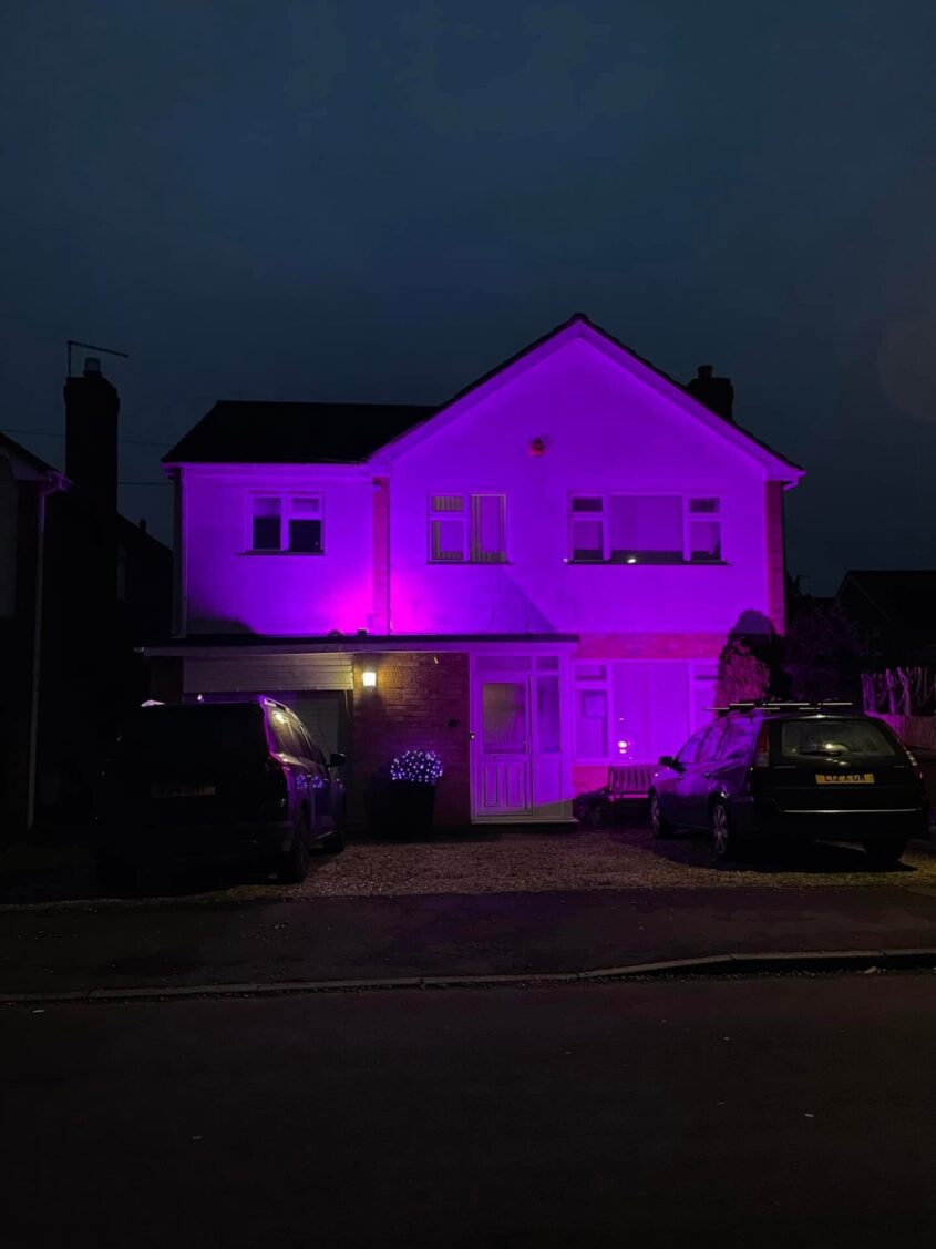 A home with purple lights for Pancreatic Cancer Awareness Month