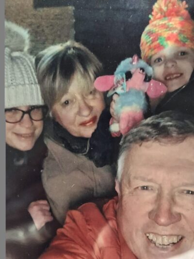 Selfie with older couple and two young children, all in winter clothes and smiling to camera