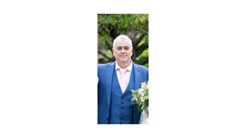 Older man dressed in smart clothing for a wedding